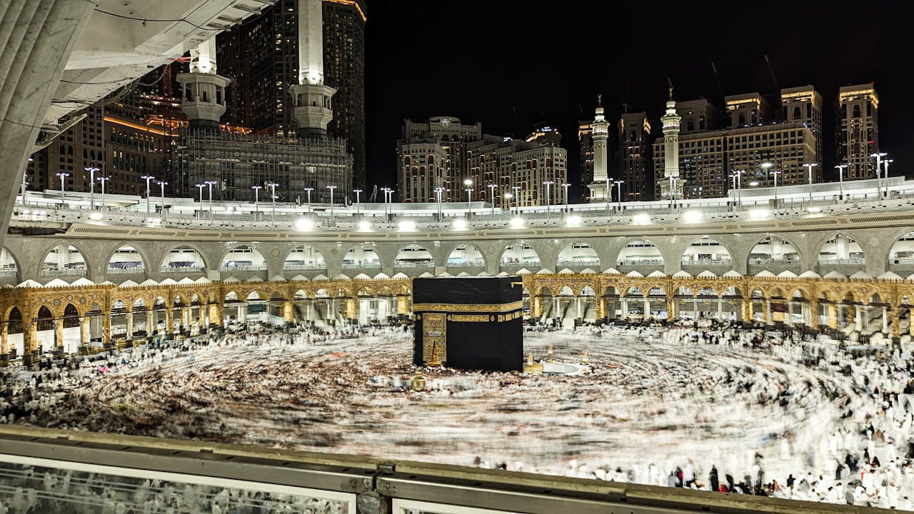 Captivating night view of worshippers circling the Kaaba at Masjid al-Haram, Mecca.